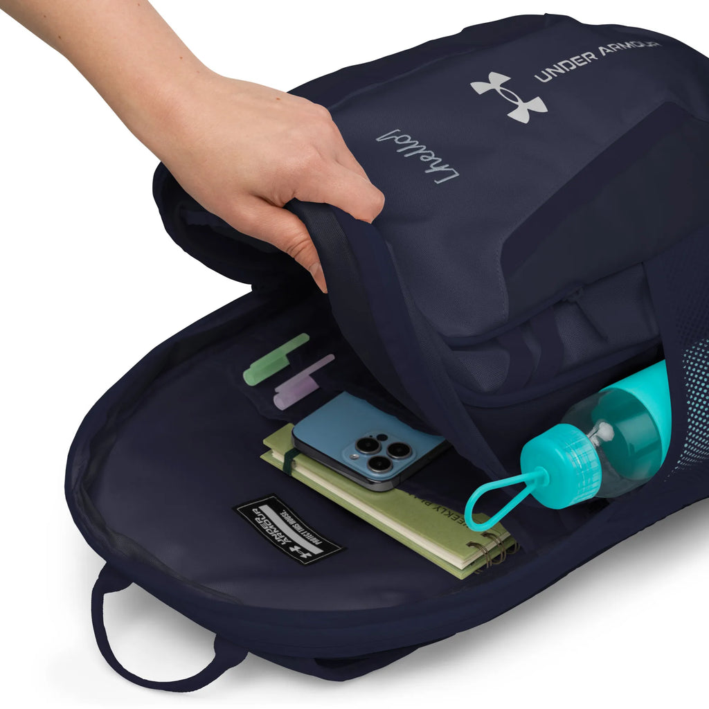 Under Armour UA Storm Commuter Backpack in Midnight Navy, showing the open front zippered pocket with organizational slots for phone and notebooks.