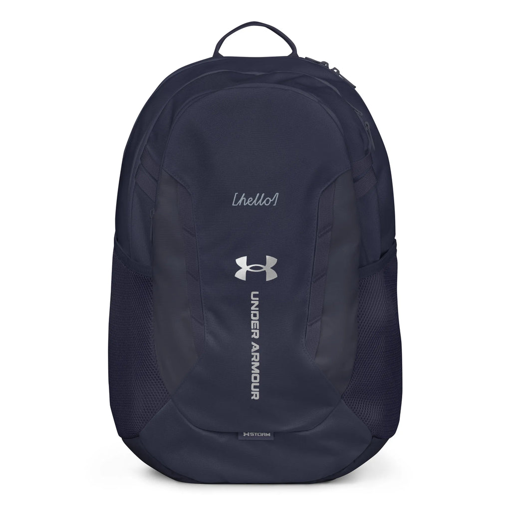 Under Armour UA Storm Commuter Backpack in Midnight Navy, front view showing the water-resistant fabric and logo.