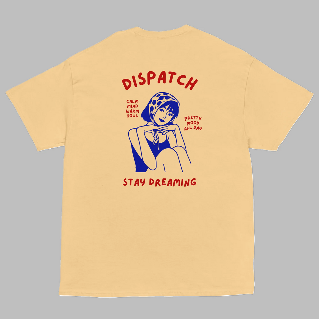 Pastel yellow crewneck t-shirt with retro Dispatch Stay Dreaming graphic print on back