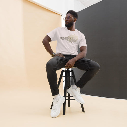 Male model sitting on a stool wearing white unisex cotton t-shirt with gold Austria soccer map design