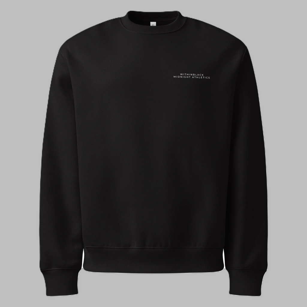 Front flat lay view of a solid black crewneck sweatshirt against a grey background, featuring minimalist white text on the left chest reading 'WITHINBLACK MIDNIGHT ATHLETICS'.