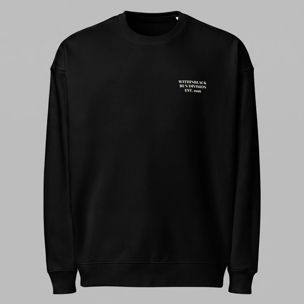 Front view of a black crewneck sweatshirt displayed flat against a grey background, featuring minimalist off-white text printed on the left chest reading 'WITHINBLACK RUN DIVISION EST. 1996'.