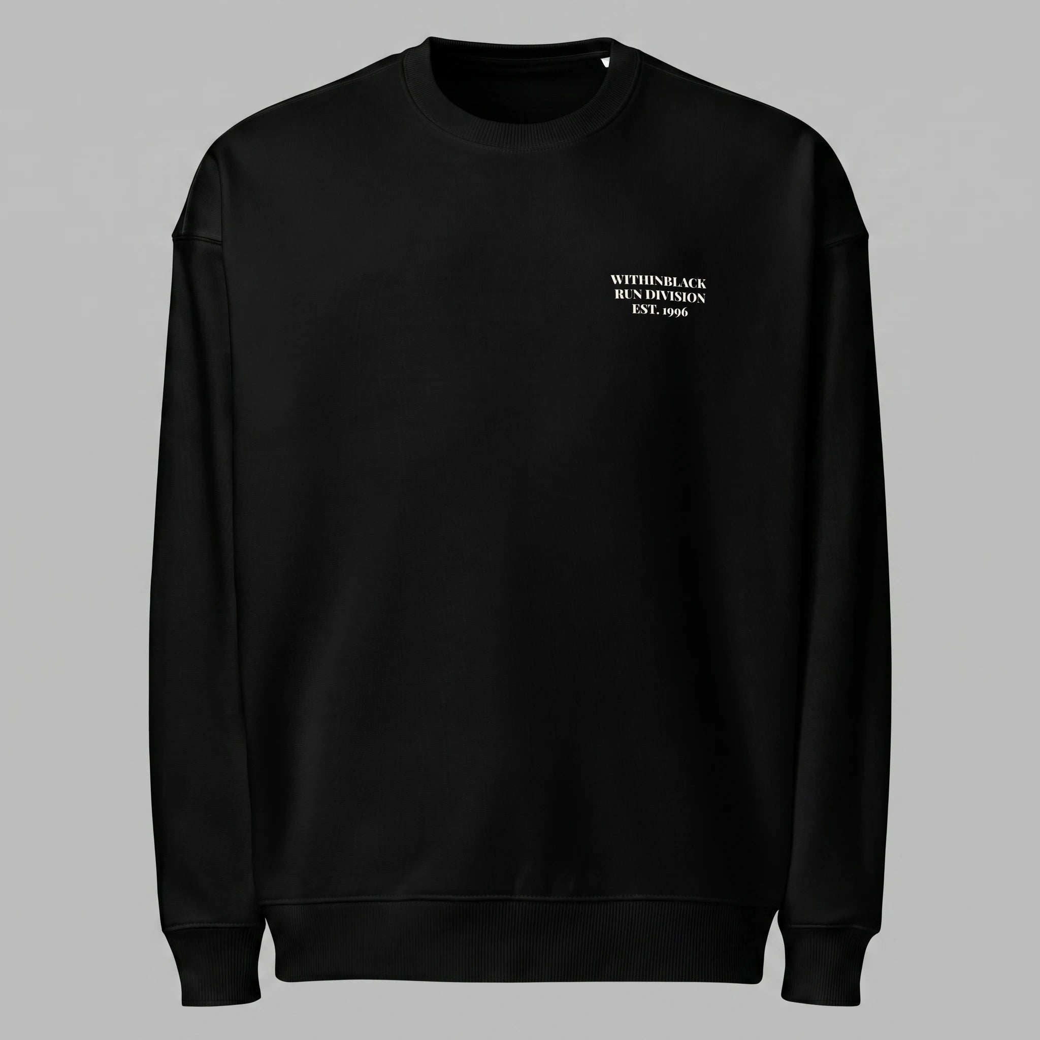 Front view of a black crewneck sweatshirt displayed flat against a grey background, featuring minimalist off-white text printed on the left chest reading 'WITHINBLACK RUN DIVISION EST. 1996'.